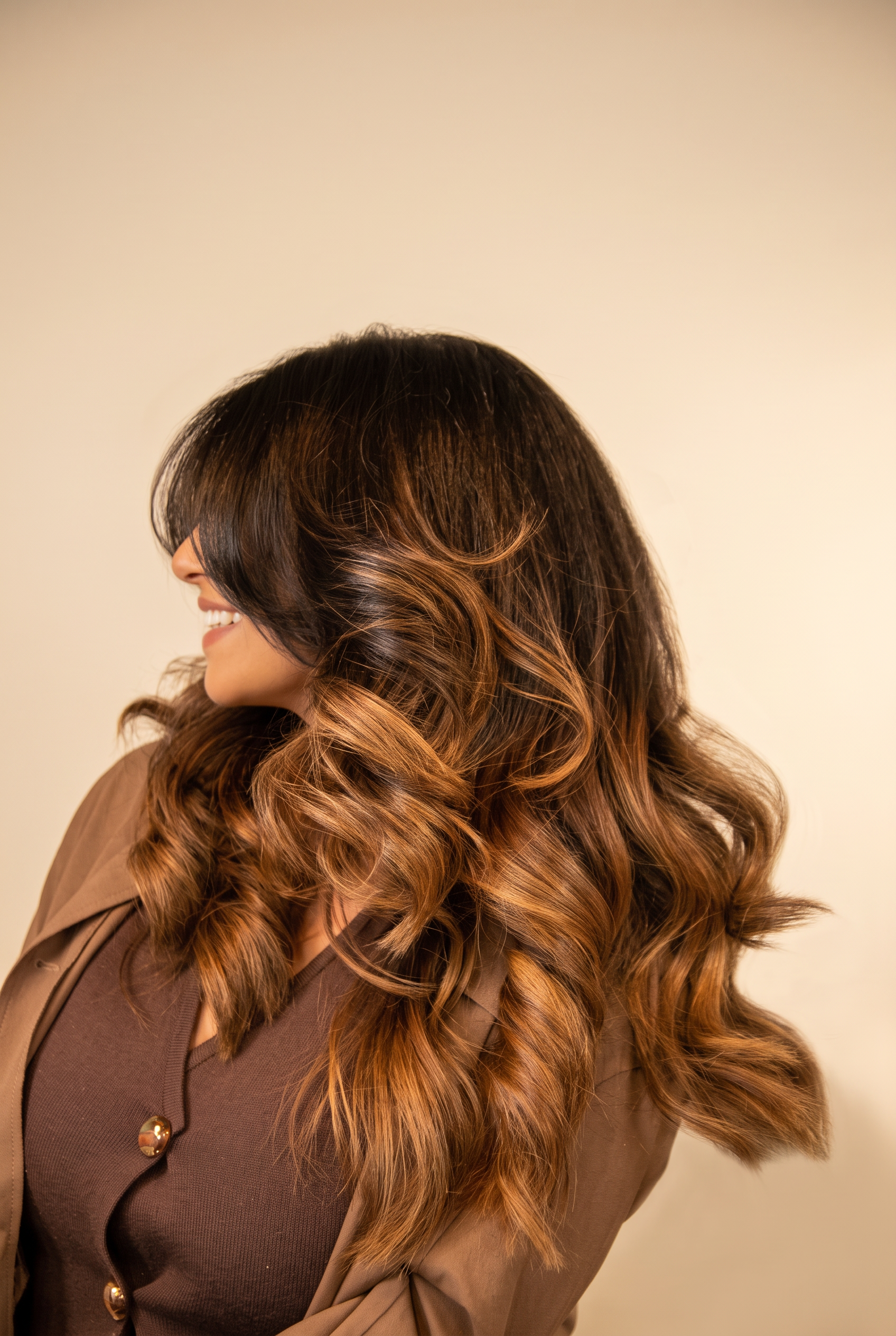 Client with long layered waves after a cut and blow dry at Icon Hair Salon Amsterdam Zuid
